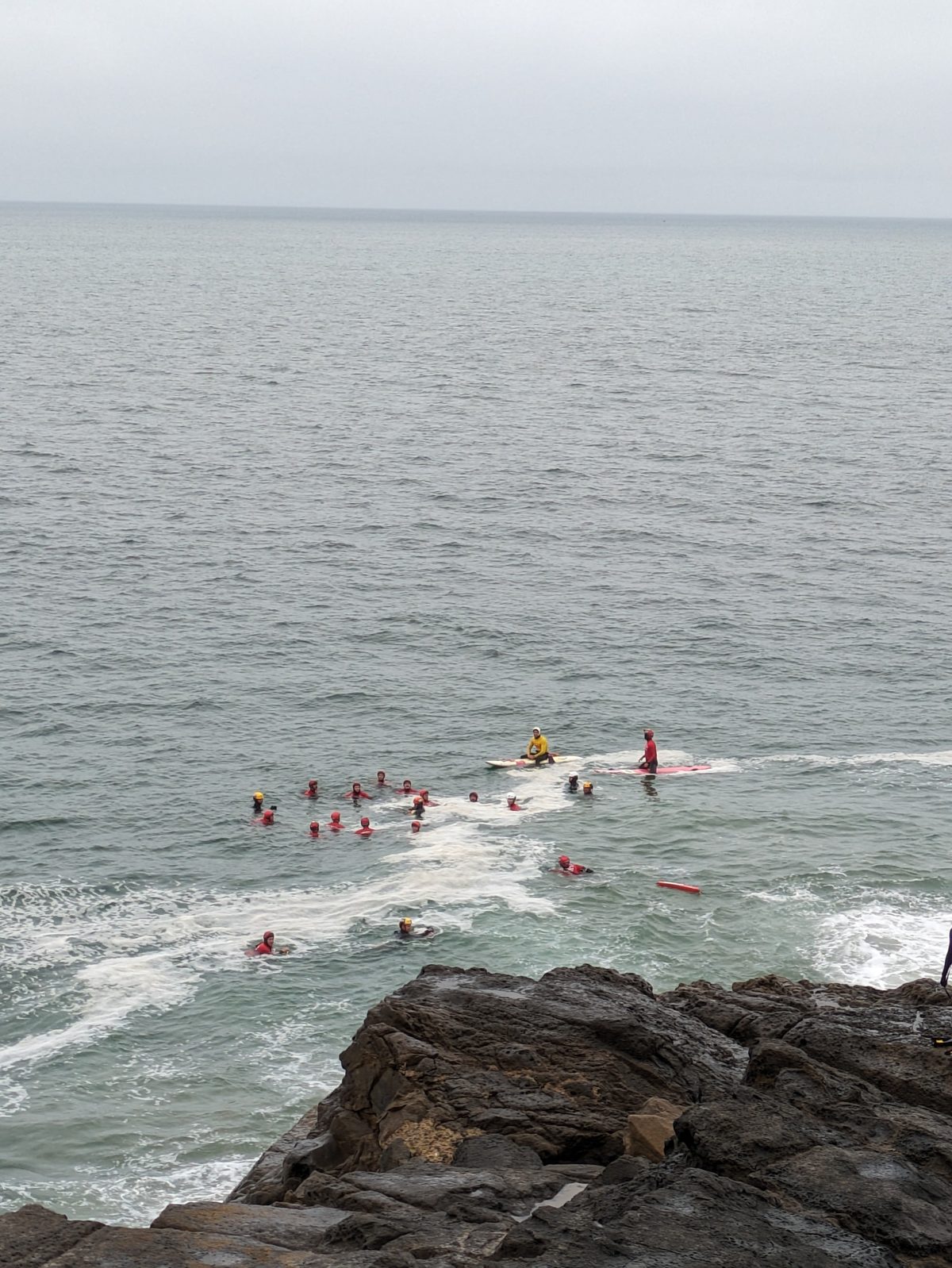 Trainees regrouping in open water below Mugu Rock with rescue boards
